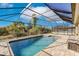 Relaxing screened pool and patio area, perfect for outdoor enjoyment at 22419 Bette Ave, Port Charlotte, FL 33954