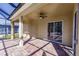 Covered patio with sliding glass doors at 22419 Bette Ave, Port Charlotte, FL 33954