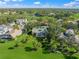 Aerial view of home with pool and golf course views at 227 Saint James Park, Osprey, FL 34229