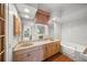 Relaxing bathroom featuring a bathtub and double vanity at 227 Saint James Park, Osprey, FL 34229