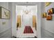 Elegant entryway with tiled floors and ornate mirror at 227 Saint James Park, Osprey, FL 34229