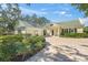 Two-car garage and inviting front entryway at 227 Saint James Park, Osprey, FL 34229