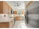 Bright kitchen with stainless steel appliances and light wood cabinets at 227 Saint James Park, Osprey, FL 34229