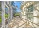 Screened patio with seating area, offering tranquil views at 227 Saint James Park, Osprey, FL 34229