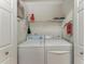 Convenient laundry closet with washer and dryer at 2400 Feather Sound Dr # 215, Clearwater, FL 33762