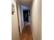 Hallway with wood floors and access to living area at 2601 Gulf N Dr # S2, Bradenton Beach, FL 34217