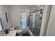 Clean bathroom with walk-in shower and backyard access at 3001 Seasons Blvd, Sarasota, FL 34240