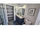 Stylish bathroom with navy vanity and modern fixtures at 3001 Seasons Blvd, Sarasota, FL 34240