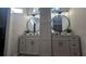 Elegant bathroom with double vanity and modern lighting at 3001 Seasons Blvd, Sarasota, FL 34240