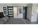 Spacious bedroom with barn doors and backyard view at 3001 Seasons Blvd, Sarasota, FL 34240