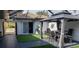 Lush green courtyard with gazebo and modern patio furniture at 3001 Seasons Blvd, Sarasota, FL 34240