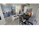 Modern kitchen with blue cabinets, granite island, and stainless steel appliances at 3001 Seasons Blvd, Sarasota, FL 34240