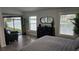 Main bedroom with lake view, dresser, and comfortable bed at 3001 Seasons Blvd, Sarasota, FL 34240