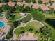 Aerial view of community green space and putting green at 314 Mystic Falls Dr, Apollo Beach, FL 33572