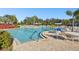 Relaxing community pool with ample lounge chairs at 314 Mystic Falls Dr, Apollo Beach, FL 33572