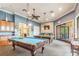 Community game room with two billiard tables and seating at 314 Mystic Falls Dr, Apollo Beach, FL 33572