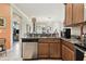 Kitchen island with sink and dishwasher, open to living room at 314 Mystic Falls Dr, Apollo Beach, FL 33572