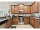 Spacious kitchen with wood cabinets and granite countertops at 314 Mystic Falls Dr, Apollo Beach, FL 33572