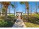 Wooden gazebo and dock overlooking lake at 314 Mystic Falls Dr, Apollo Beach, FL 33572