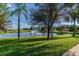 Serene pond with fountain and lush green landscaping at 314 Mystic Falls Dr, Apollo Beach, FL 33572