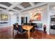 Bright dining room with hardwood floors and modern light fixture at 340 S Palm Ave # 45, Sarasota, FL 34236