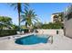 Community pool with surrounding patio furniture at 340 S Palm Ave # 45, Sarasota, FL 34236