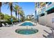 Resort-style pool and spa with lounge chairs at 340 S Palm Ave # 45, Sarasota, FL 34236