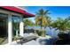 Relaxing deck overlooking a lake with patio furniture at 3465 Winding Oaks Dr # 33, Longboat Key, FL 34228