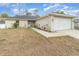 Newly built home with a two-car garage and landscaped front yard at 3623 Giblin Dr, North Port, FL 34286