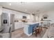 Bright kitchen featuring white cabinetry, a center island, and stainless steel appliances at 3623 Giblin Dr, North Port, FL 34286