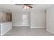 Open living area with tile floors, neutral walls, and an entry door at 3623 Giblin Dr, North Port, FL 34286