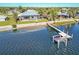 Aerial view of waterfront property with private dock and pool at 3662 Peace River Dr, Punta Gorda, FL 33983