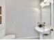 Simple, clean, and well-lit half bathroom at 3662 Peace River Dr, Punta Gorda, FL 33983