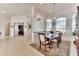 Elegant formal dining room features a chandelier and large windows at 3662 Peace River Dr, Punta Gorda, FL 33983