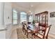 Bright dining room with hardwood floors and built-in hutch at 3662 Peace River Dr, Punta Gorda, FL 33983