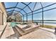 Enclosed pool and spa area with waterfront views at 3662 Peace River Dr, Punta Gorda, FL 33983