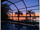 Stunning sunset view from screened pool area at 3662 Peace River Dr, Punta Gorda, FL 33983