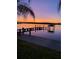 Stunning sunset view over calm water from private dock at 3662 Peace River Dr, Punta Gorda, FL 33983