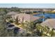 Aerial view of a community featuring lakefront properties with ample parking at 3715 45Th W Ter # 108, Bradenton, FL 34210