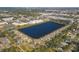 Aerial view of community by a lake, showcasing surrounding areas at 3715 45Th W Ter # 108, Bradenton, FL 34210