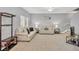 Spacious living room with neutral decor and stairs at 3715 45Th W Ter # 108, Bradenton, FL 34210