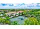 Aerial view of community tennis courts and residential buildings at 3766 82Nd Avenue E Cir # 106, Sarasota, FL 34243