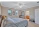 Spacious bedroom with ensuite bathroom access and large windows at 3766 82Nd Avenue E Cir # 106, Sarasota, FL 34243