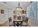 Bright dining area next to the kitchen with a glass-top table and chairs at 3766 82Nd Avenue E Cir # 106, Sarasota, FL 34243