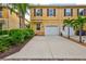 Townhouse with a two-car garage and landscaped front yard at 3766 82Nd Avenue E Cir # 106, Sarasota, FL 34243