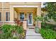 Welcoming front entrance with lush landscaping and a charming porch at 3766 82Nd Avenue E Cir # 106, Sarasota, FL 34243