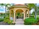 Community gazebo with benches and scenic pond view at 3766 82Nd Avenue E Cir # 106, Sarasota, FL 34243