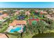 Aerial view of community pool and tennis courts at 3803 Wilshire W Cir # 37, Sarasota, FL 34238