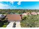 Aerial view showcasing a house near a lake with surrounding houses at 3803 Wilshire W Cir # 37, Sarasota, FL 34238