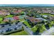 Community overview featuring tennis courts, pool, and parking at 3803 Wilshire W Cir # 37, Sarasota, FL 34238